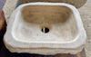 Lavabo de piedra travertino marron.