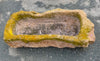 Pilón rectangular de piedra.