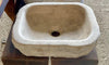 Lavabo de piedra travertino marron.