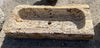 Pilónes de piedra travertino.