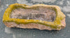 Pilón rectangular de piedra.