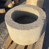 Pilon de piedra redondo.