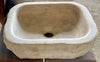 Lavabo de piedra travertino marron.