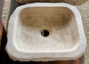 Lavabo de piedra travertino marron.