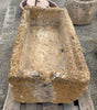 Pilón de piedra con restos de fosiles.