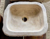Lavabo de piedra travertino marron.