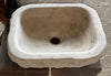 Lavabo de piedra travertino marron.