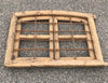 Ventana de madera con reja.
