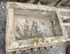 Pilón rectangular de piedra.