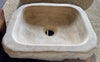 Lavabo de piedra travertino marron.