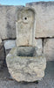 Fuente de piedra de pared.
