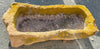 Pilón rectangular de piedra.
