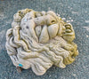 Mascaron de piedra.