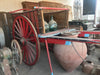 Carro de varas rojo.