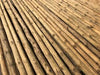 Vigas de madera redondas muy finas de 2,5 metros.