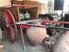 Carro de varas rojo.