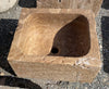 Lavabo de piedra travertino marrón.