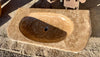Lavabo de piedra travertino amarillo.