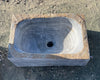 Lavabo de mármol gris.