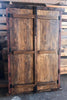 Ventana de madera con reja embutida.