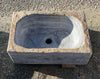 Lavabo de mármol gris.