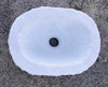 Lavabo ovalado de mármol.