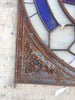 Puerta de hierro y cristal de colores recuperada.